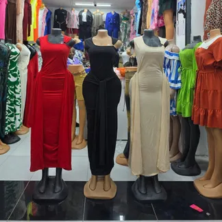 Classy dinner dresses in red, black and beige on mannequins