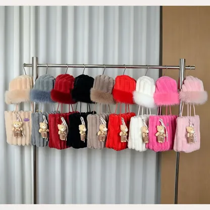 Knitted fur hats and tote bags with teddy charms on a rack