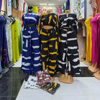 Tie-dye palazzo sets in blue, yellow and black on mannequins
