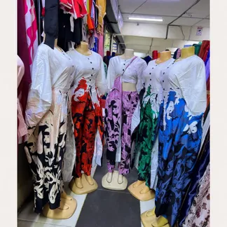 Printed kaftan top and trouser sets on mannequins